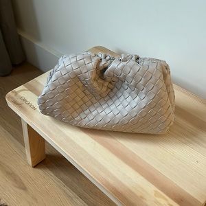 Cream woven dumpling clutch